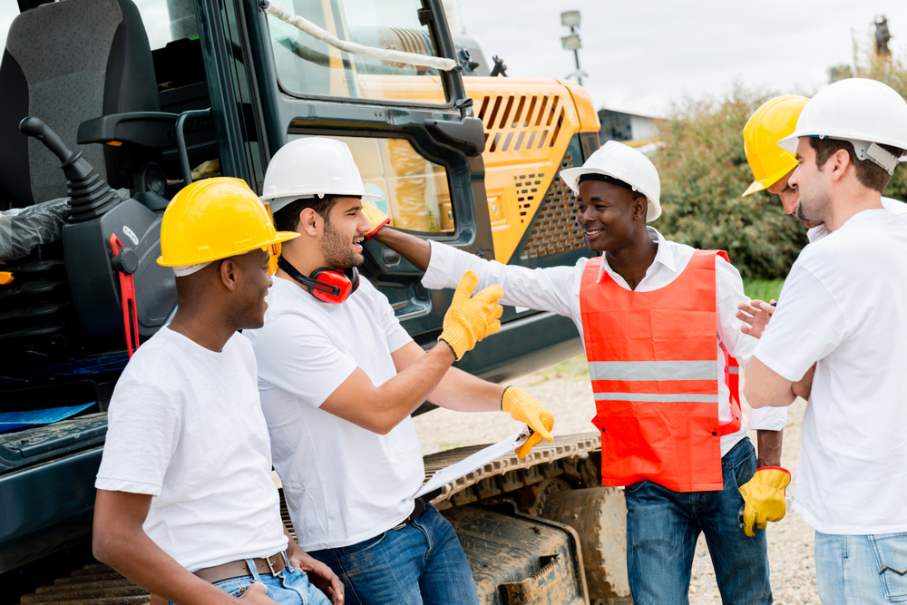 Group of workers talking at a building site